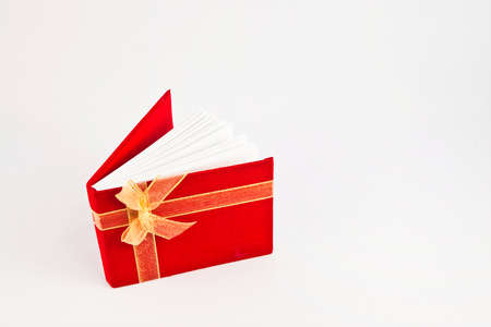 Red notebook isolated on white backgroundの写真素材