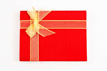 Red notebook isolated on white backgroundの写真素材