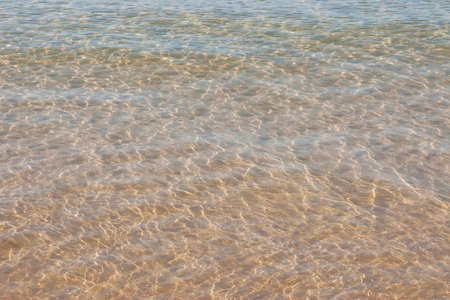 Texture of light reflex on sea waterの写真素材