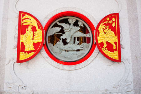 Design of Chinese sculpture on temple doorの写真素材