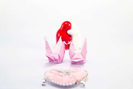 Lover dolls and paper bird isolate on whiteの写真素材