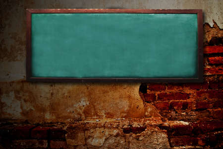 Wood chalk board on grunge wallの写真素材