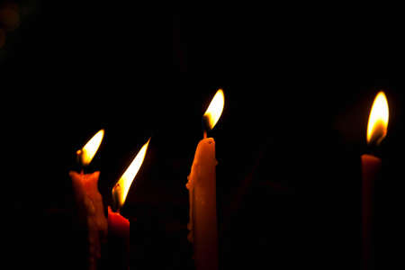 Candle lights isolated on black backgroundの写真素材