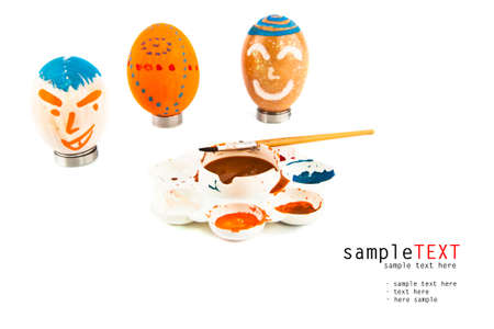 Easter eggs and color tray isolated on whiteの写真素材