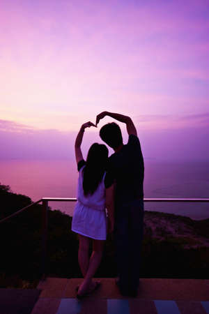 Couple makes the heart by their handsの写真素材