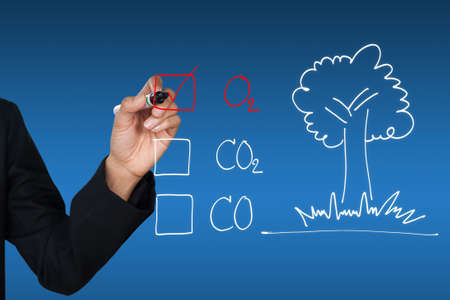 Hand selecting O2 and tree icon, can be used for go green conceptの写真素材