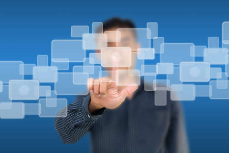 Business man pushing white touch screen iconsの写真素材