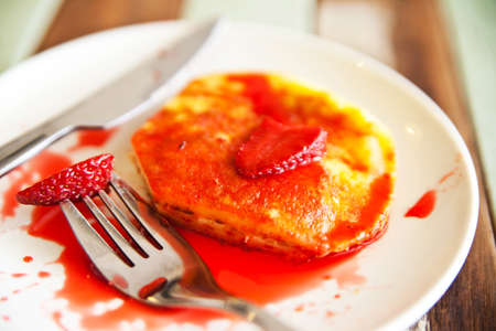 Strawberry fruit top up on pan cake breakfastの写真素材