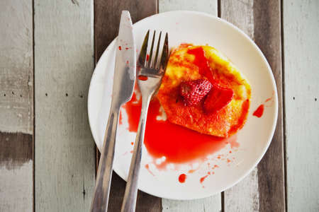 Strawberry fruit top up on pan cake breakfastの写真素材