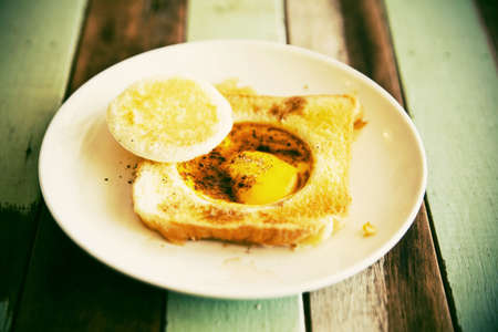 Venus egg on bread breakfast, vintage styleの写真素材
