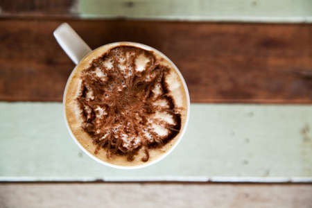 Cup of coffee on vintage wood backgroundの写真素材