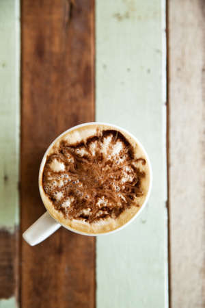 Cup of coffee on grunge wooden floorの写真素材