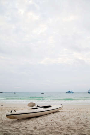 Kayak boat on the beach and skyの写真素材