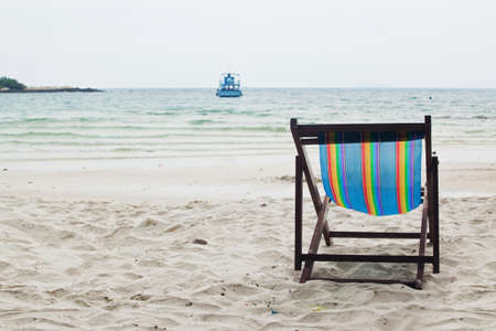 Beach chair on white sand beachの写真素材