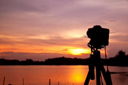 Digital camera against sunset backgroundの写真素材