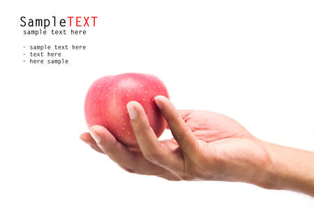Hand holding red apple fruit, isolate on white backgroundの写真素材
