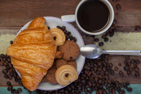 Cookies with croissant and coffee beansの写真素材