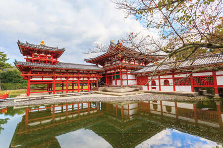 Byodo-in buddhist temple in autumn season against blue sky background at Kyoto, Japanのeditorial素材
