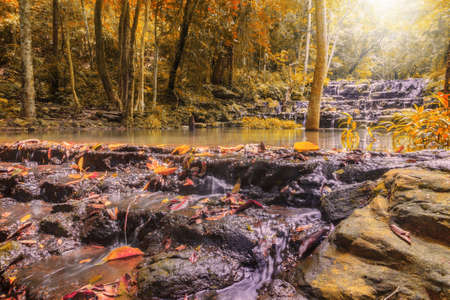 Beatiful of waterfall in colorful autumn forest with sun ray, Saraburi, Thailandの写真素材