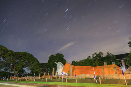 Startrail over big buddha image at Thailandの写真素材