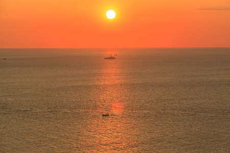 Beautiful sunset at Promthep cape view point, Phuket, Thailandの写真素材