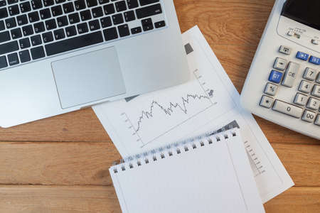 Open laptop with digital tablet and white smartphone, business and investment conceptの写真素材