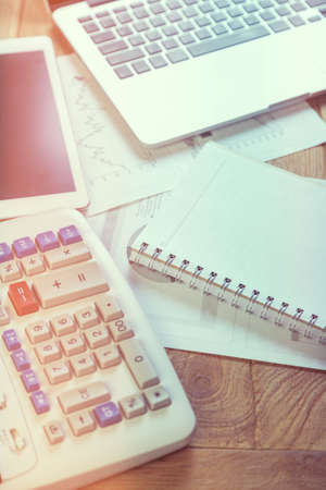 Business woman putting her hand on calculator, business and investment conceptの写真素材