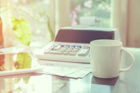 Open laptop and accessories with coffee cup for home workplace