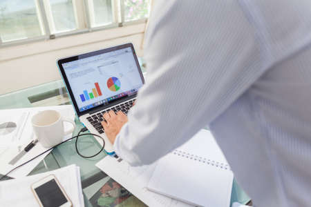 Open laptop and accessories with coffee cup for home workplace