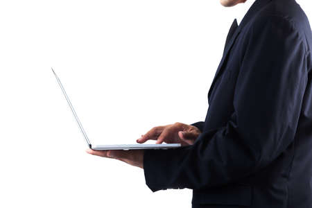 Business man holding laptop isolated on white backgroundの写真素材