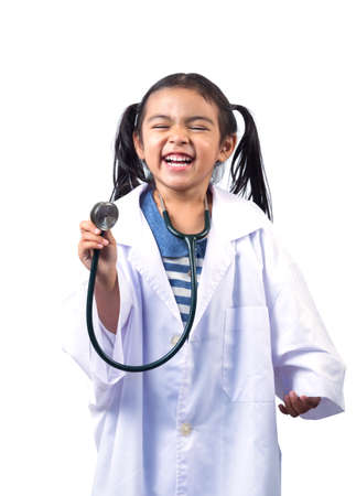 Smiling little girl playing doctor and holding stethoscope isolated on whiteの写真素材
