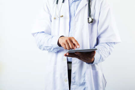 Doctor holding stethoscope isolated on white background, Healthcare and Medicine conceptのeditorial素材