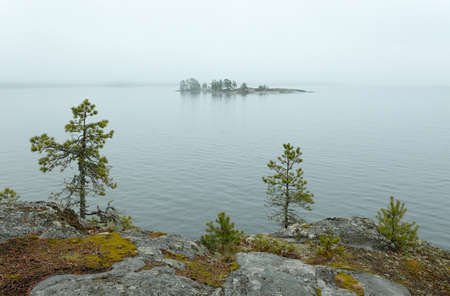 Island in the fog. Lake Ladogaの写真素材