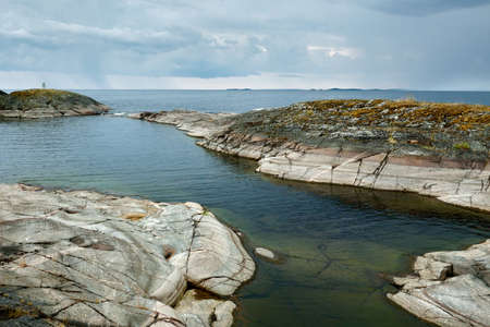 Evening landscape. Stone shores. Karelia, Lake Ladogaの写真素材