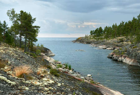 Evening landscape. Stone shores. Karelia, Lake Ladogaの写真素材