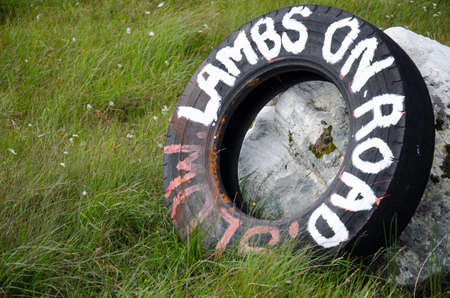 old tire with warning inscription