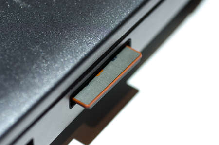 SD (secure digital) memory card inserted in laptopの写真素材