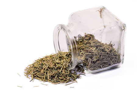 dry rosemary scattered isolated on white の写真素材