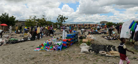 ARUSHA, TANZANIA - 22 MARCH: people buying products on the market on march 22, 2013 in Arusha, Tanzaniaのeditorial素材