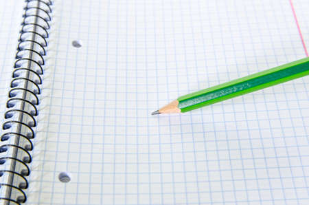 exercise book and pencil writing - stock photo