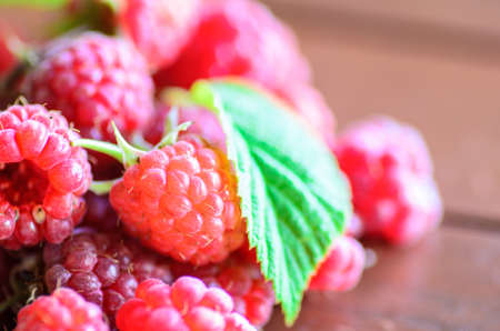 closeup of raspberry on wooden table - stock photo