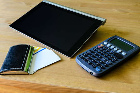 workplace with tablet pc, calculator and bussiness card の写真素材