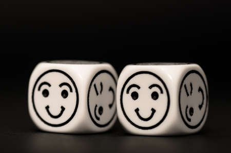 emoticon dice with happy expression sketch on black background - stock photoの写真素材