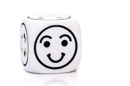 single emoticon dice with happy expression sketch isolated on white backgroundの写真素材