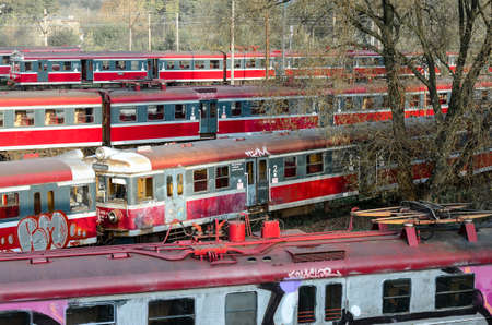 CZESTOCHOWA, POLAND - OCTOBER 21, 2014: old and not used PKP trains on sidetrack awaiting sale near depotのeditorial素材