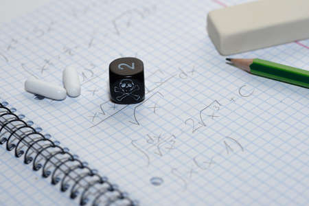 study place with painkillers in background and skull dice - stock photoの写真素材