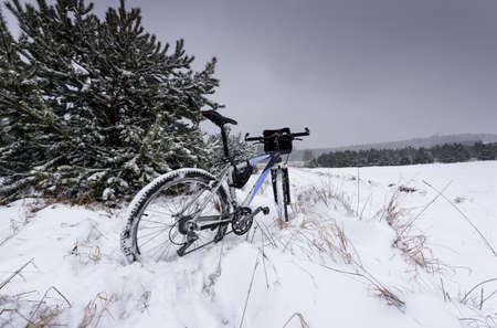 bike off the trail buried in snow in winter scenery - stock photoの写真素材