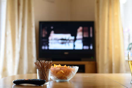 television, TV watching (movie) with snacks lying on table - stock photoの写真素材