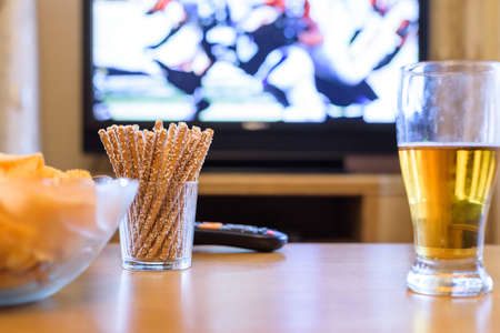 TV, television watching (American football match) on TV with snacks and alcohol - stock photoの写真素材