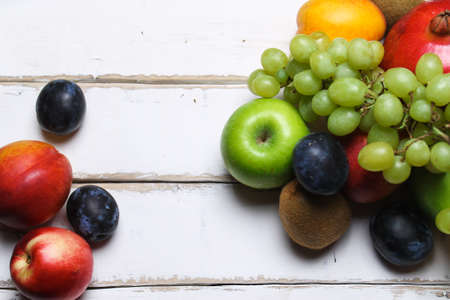 A handful of fruit on the tableの写真素材